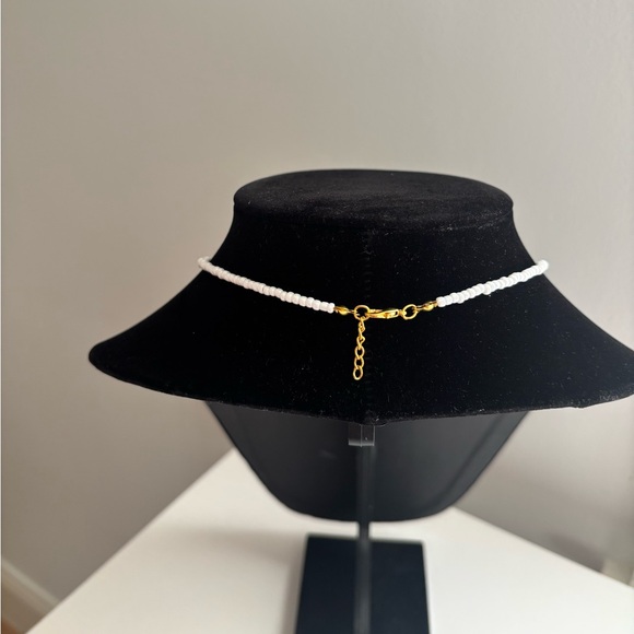 Handmade White Beaded Necklace with Gold Star and Charm - Picture 4 of 5